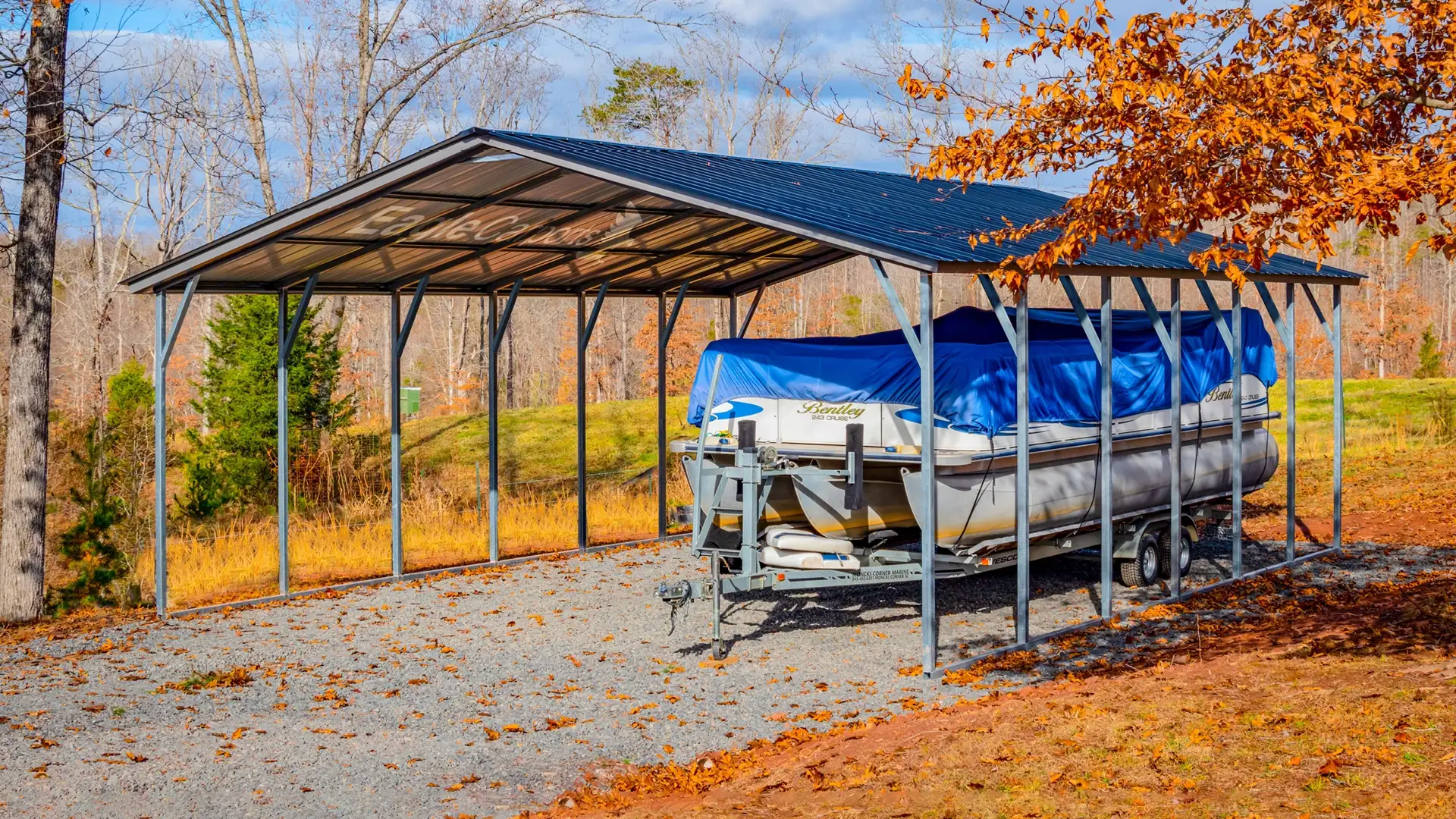 A carport with a boat underneath it.