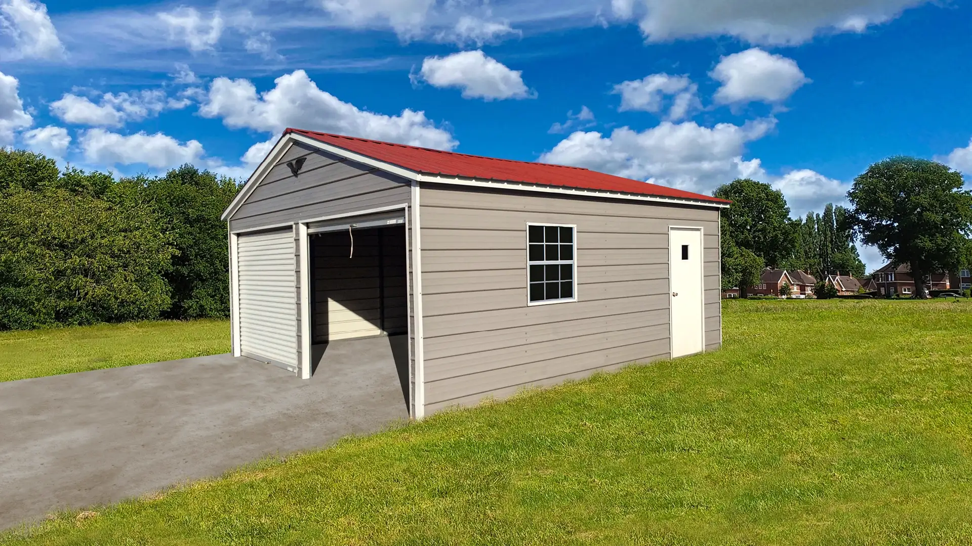 metal garage with a red roof and gray walls. The one door is open.