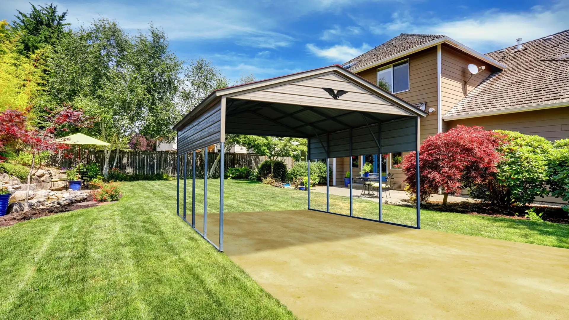 Tan metal carport sitting beside a fancy house with flowerbeds and shrubbery.